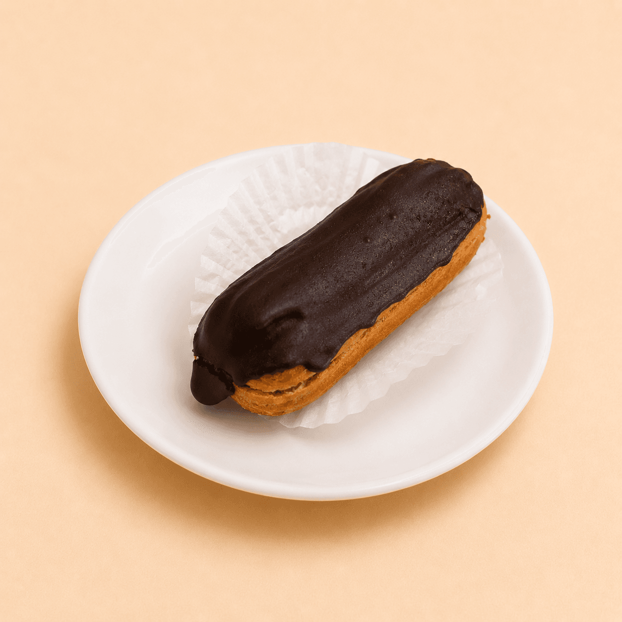 Classic éclair filled with cream and glazed with chocolate